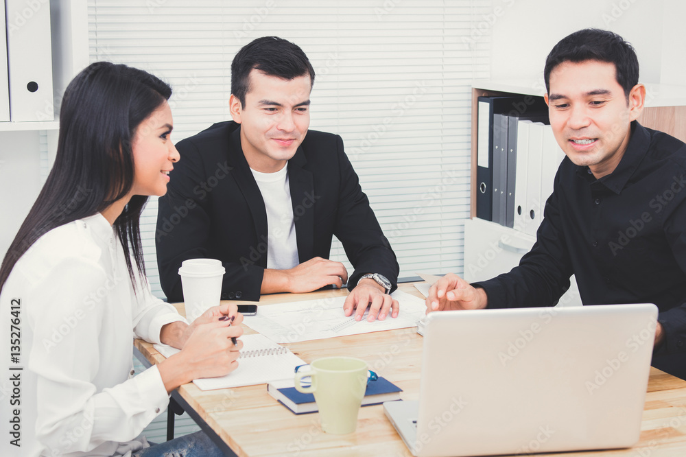 Casual business people discussing work in the meeting Casual business people discussing work in the meeting