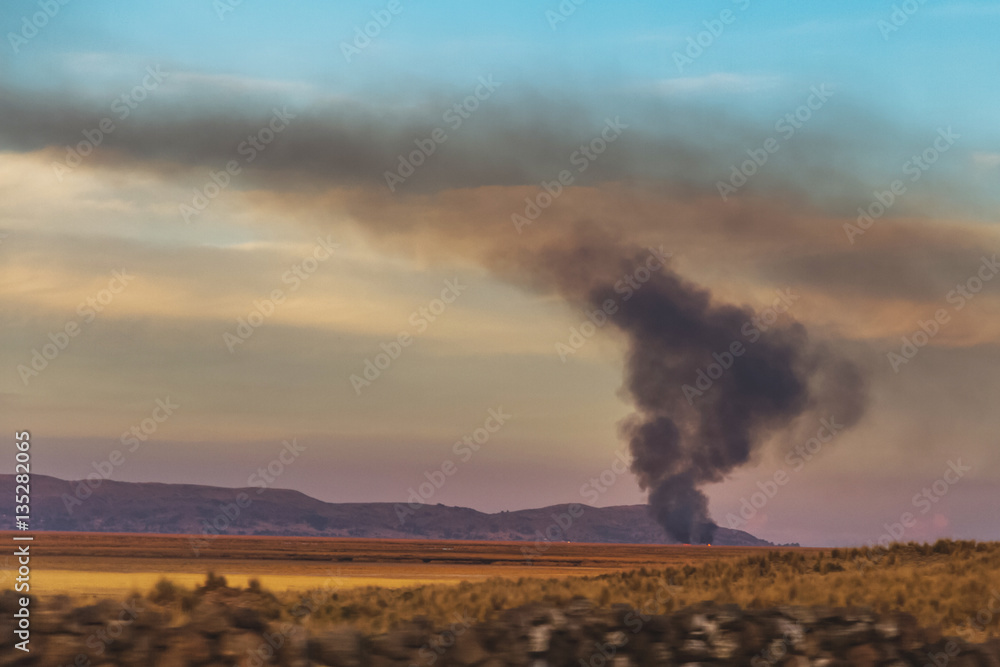 Peru. Fire in the middle of the field, sunset. Peru. Fire in the middle of the field, sunset.