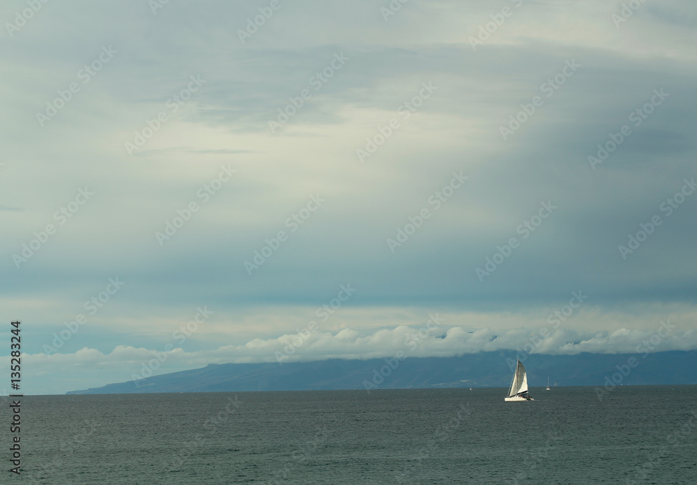 Sailing ship or yacht in blue sea