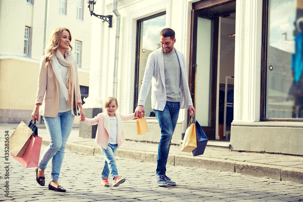 happy family with child and shopping bags in city happy family with child and shopping bags in city