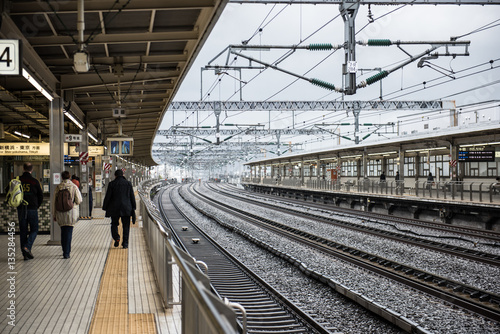 View of the Shin Yokohama railway station in Japan, which is operated by Central Japan Railway Company and is a very important transportation hub. People are seen waiting for trains. photo