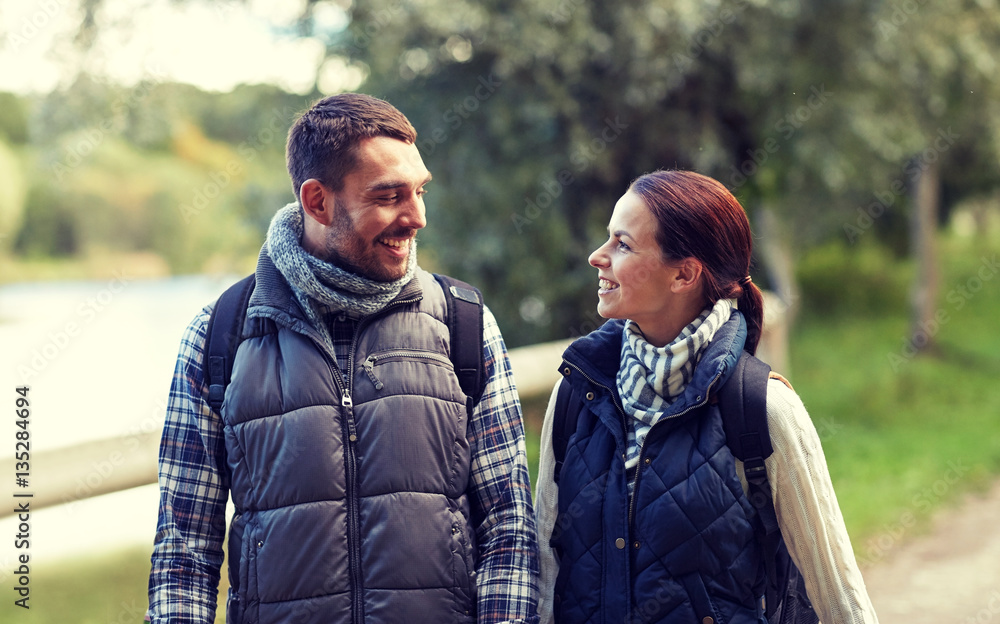 Fototapeta premium happy family walking with backpacks in woods