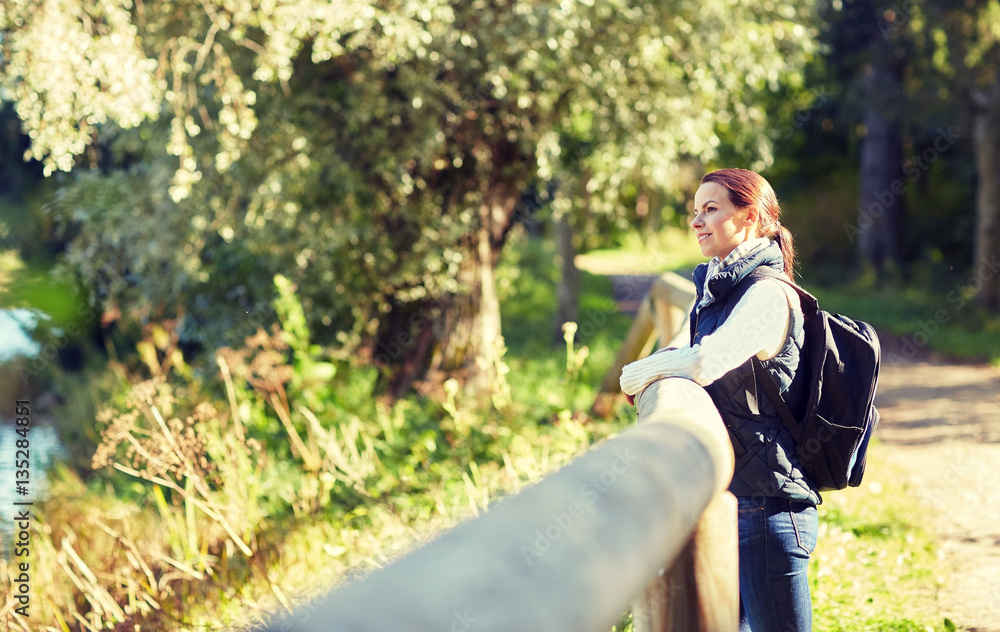 happy woman with backpack outdoors happy woman with backpack outdoors