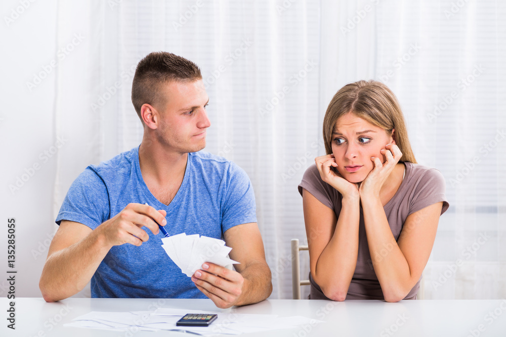 Young couple is having financial problems,husband is angry on his wife because she has spent a lot of money.
Young couple is having financial problems,husband is angry on his wife because she has spent a lot of money.