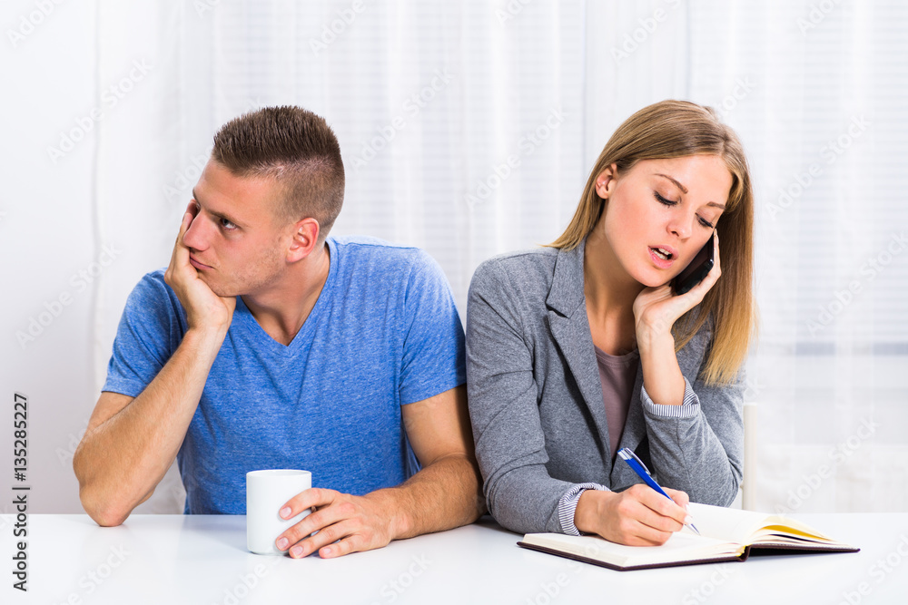Husband is very sad and he is feeling bored because his wife is thinking of her business all of the time. Husband is very sad and he is feeling bored because his wife is thinking of her business all of the time.