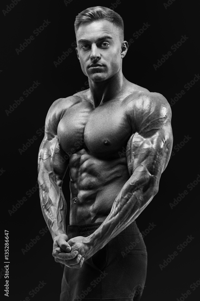 Healthy power shirtless young athletic man with strong abs and c Healthy power shirtless young athletic man with strong abs and c