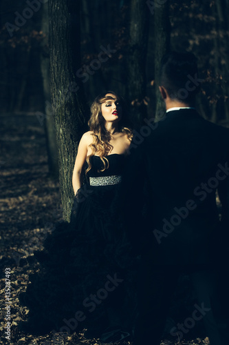 elegant young couple in forest