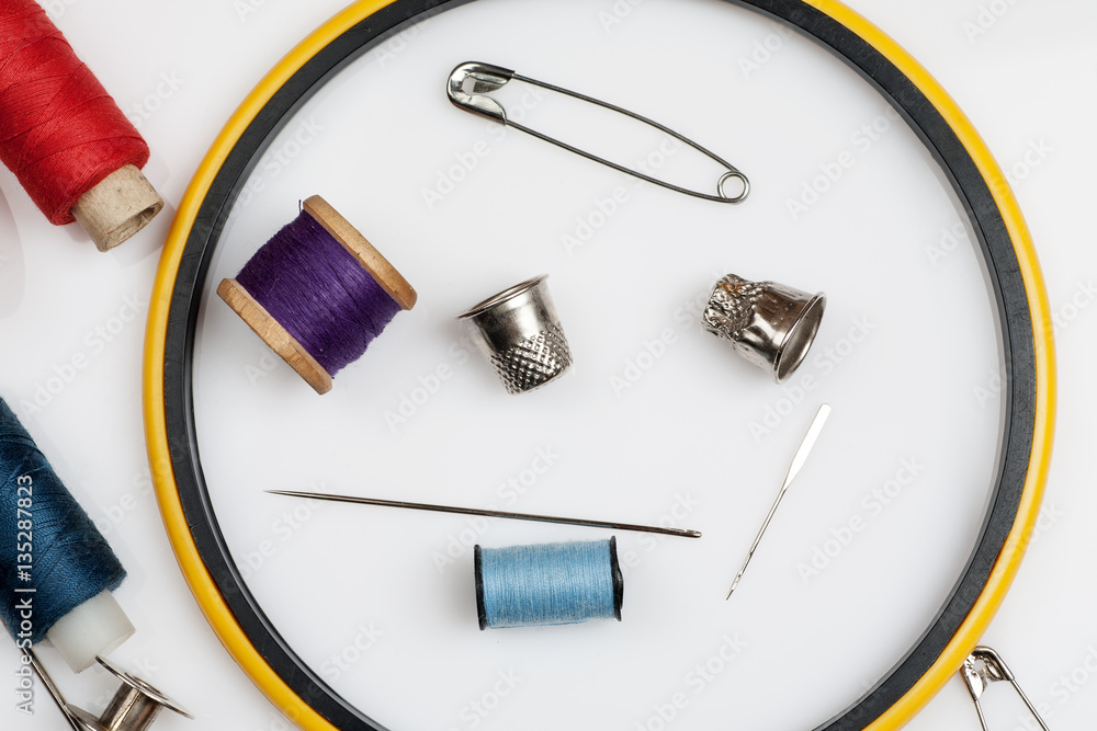 Close-up shot of items for sewing on a white background, top view