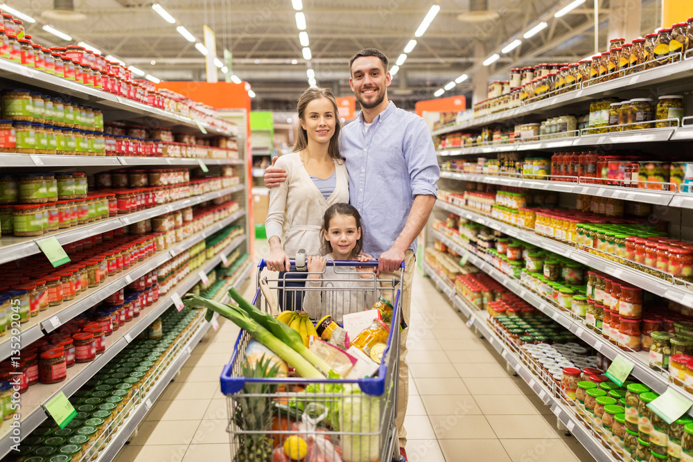 family with food in shopping cart at grocery store