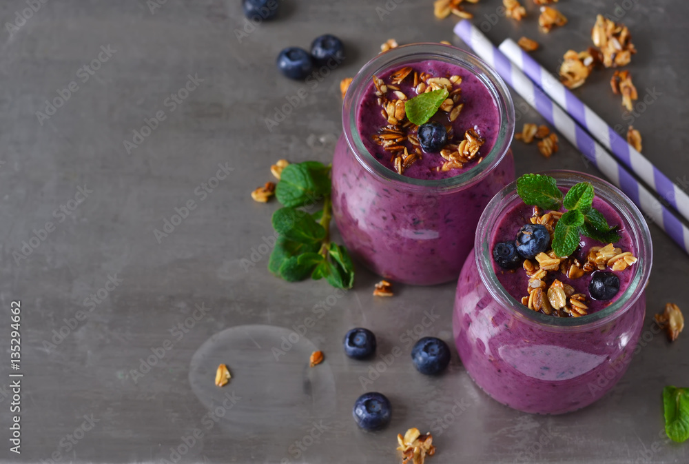 Berry yogurt with bran and oatmeal on a metal background Berry yogurt with bran and oatmeal on a metal background