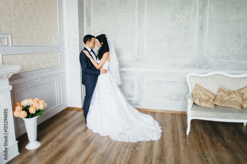 Wedding photo shoot of the newlyweds in a beautiful Studio inter