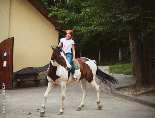 young woman on a horse