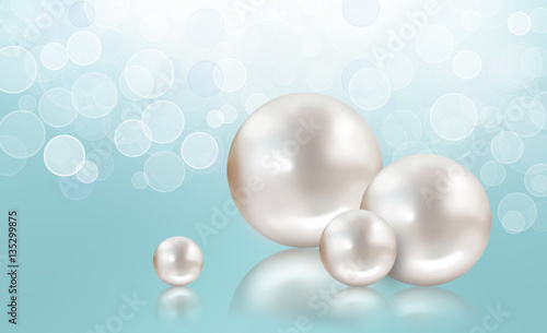 Four white pearls on aqua shimmering light background