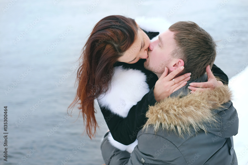Winter love story. Young couple engagement outdoors. Winter love story. Young couple engagement outdoors.