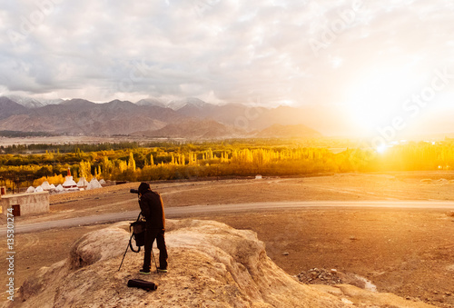 Photography Photographer waiting the light for taking photograph in the himalaya range,  blur, soft focus: Leh, Ladakh, India