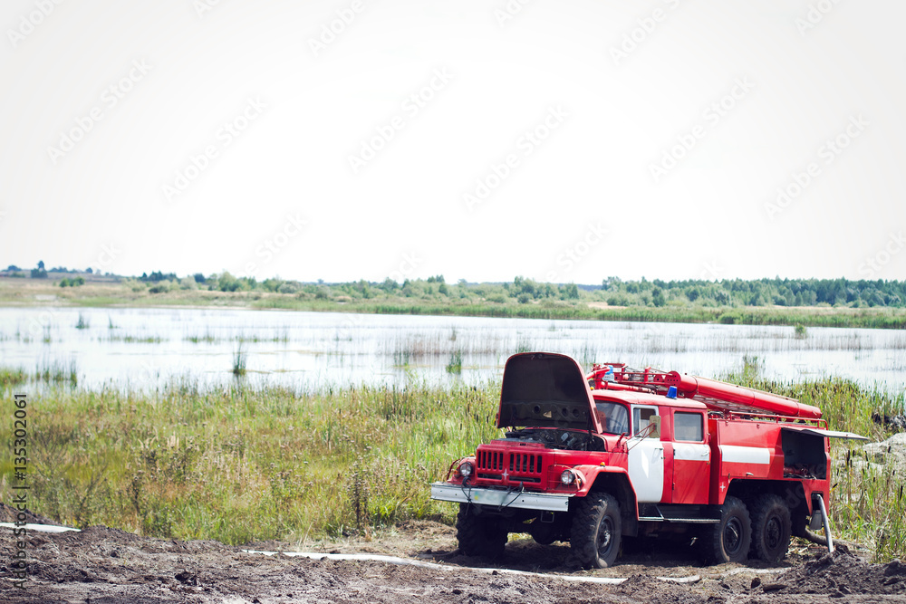 fire truck puts out in a field a forest fire fire truck puts out in a field a forest fire