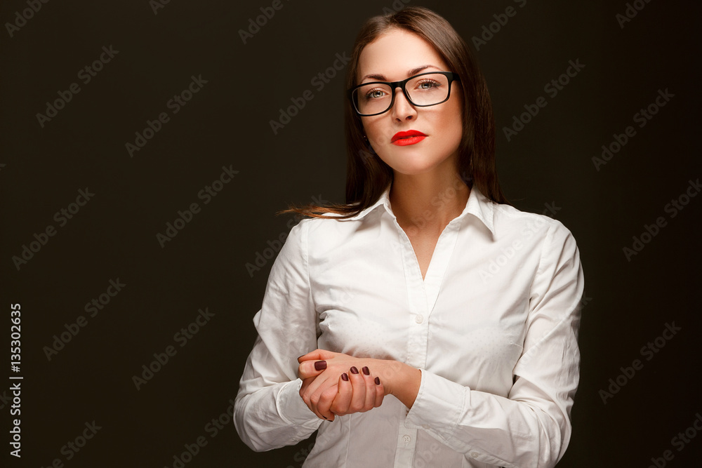 close-up of a business woman in glasses and a white shirt close-up of a business woman in glasses and a white shirt