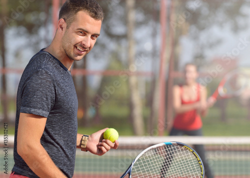 Young adult man playing tennis and preparing for sports competition. © Nastassia Yakushevic