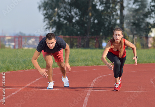 Young sport couple in starting position