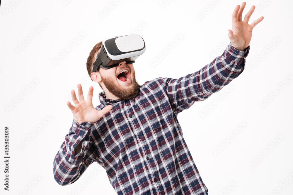 Bearded man in shirt using virtual reality device Bearded man in shirt using virtual reality device