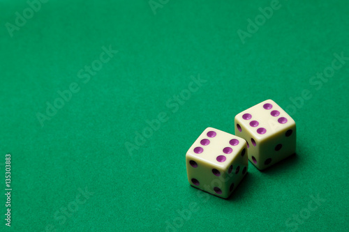 Dice the six up on green cloth