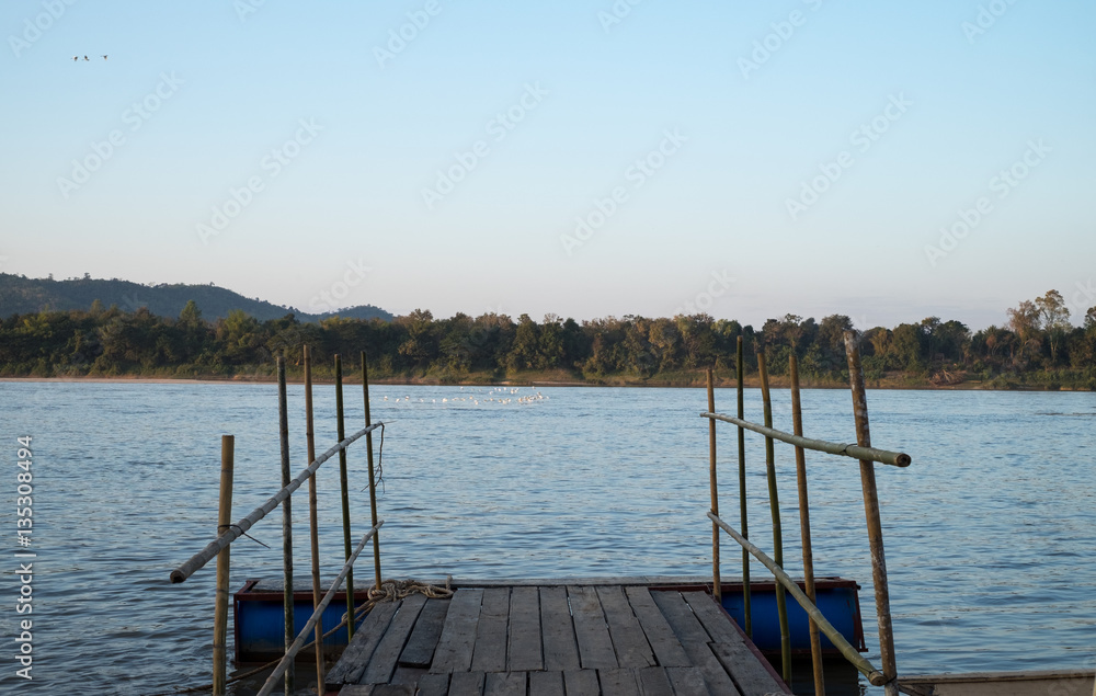 Naklejka premium wooden terrace by the Mekong river at Chiang Khan District, Loei Province, Thailand