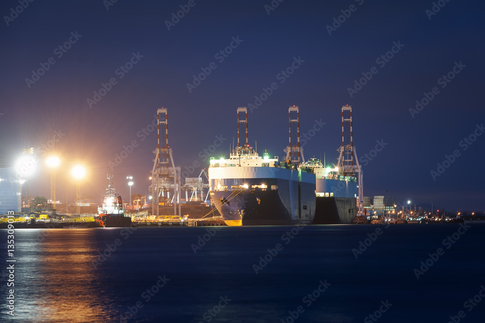 Container ship in import, export port against  twilight