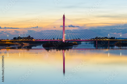 Night view of Royal Bridge over Guadiana River in Badajoz. photo