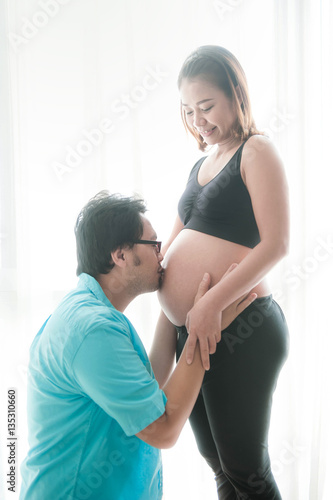 Pregnant women and man with love kiss © arhendrix
