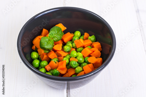 Mix boiled vegetables in a salad bowl