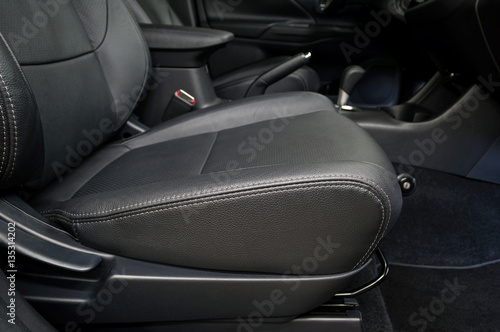 Leather car seat. Interior detail. © alexdemeshko
