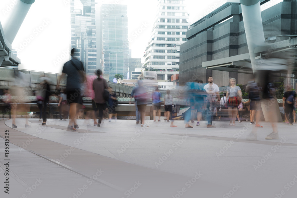 Obraz premium People walking in motion blur in the city