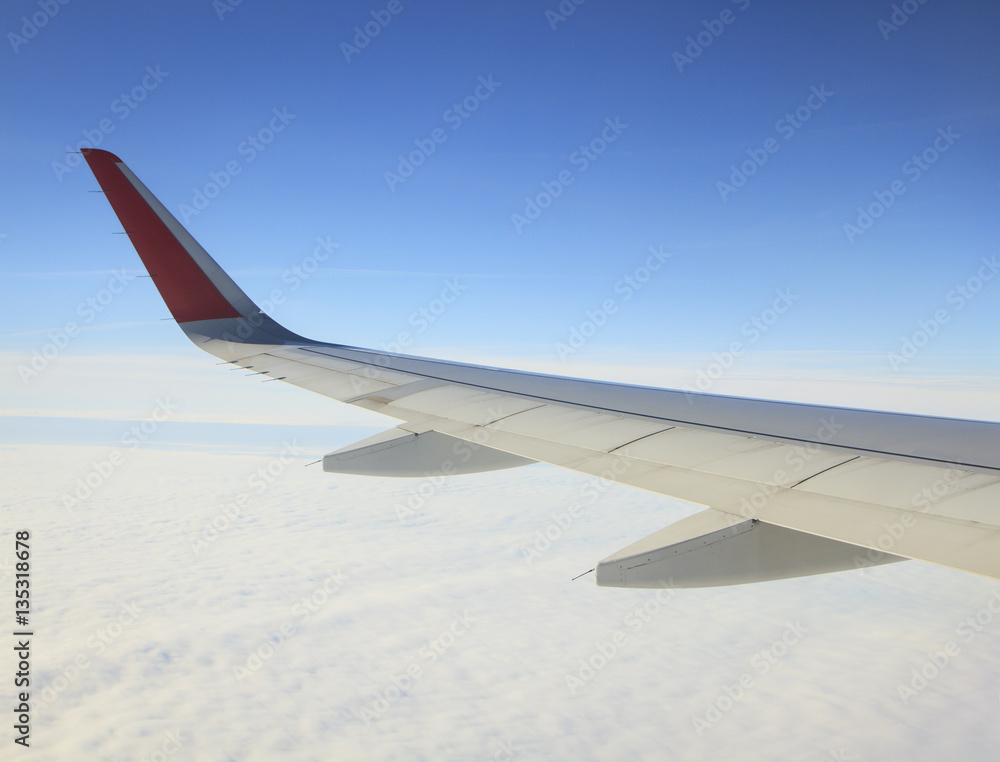 View on the Wing of airplane from window View on the Wing of airplane from window