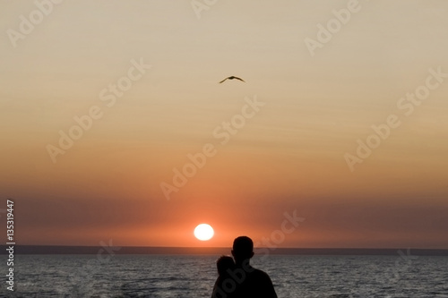 Silhouette man and woman again sunset © Aleksandr Kurganov