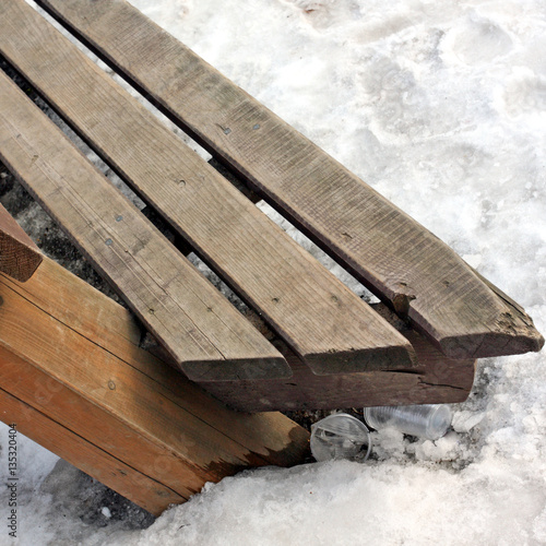 Wooden bench in winter