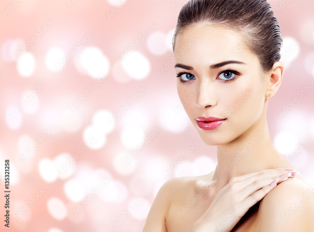 Young woman portrait, abstract background with blurred lights Young woman portrait, abstract background with blurred lights