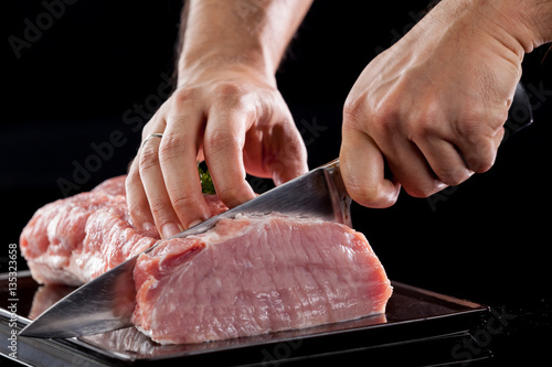 Meat, pork, slices pork loin on a black background
