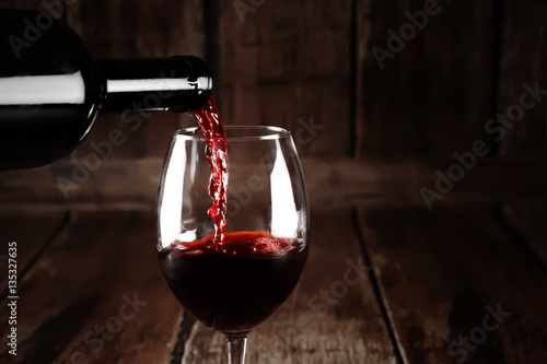 Red wine pour from bottle