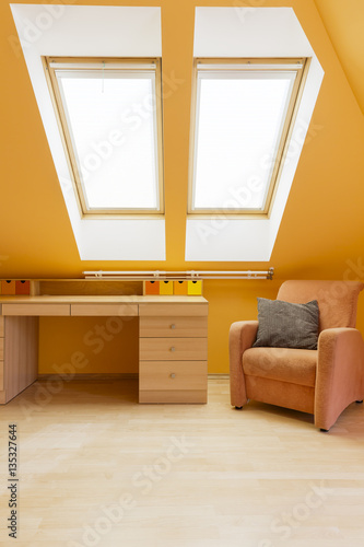 Room in warm colours with desk