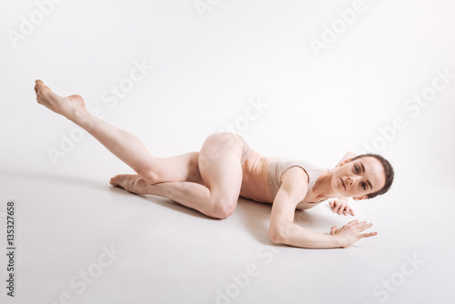 Inventive young dancer performing isolated in white background