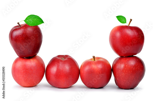 Red apples with green leaf isolated on white background.