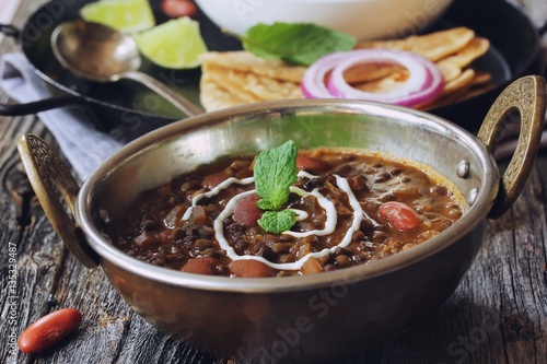 Dal Makhani / Black lentil and Red Kidney beans curry served in a Kadai, selective focus