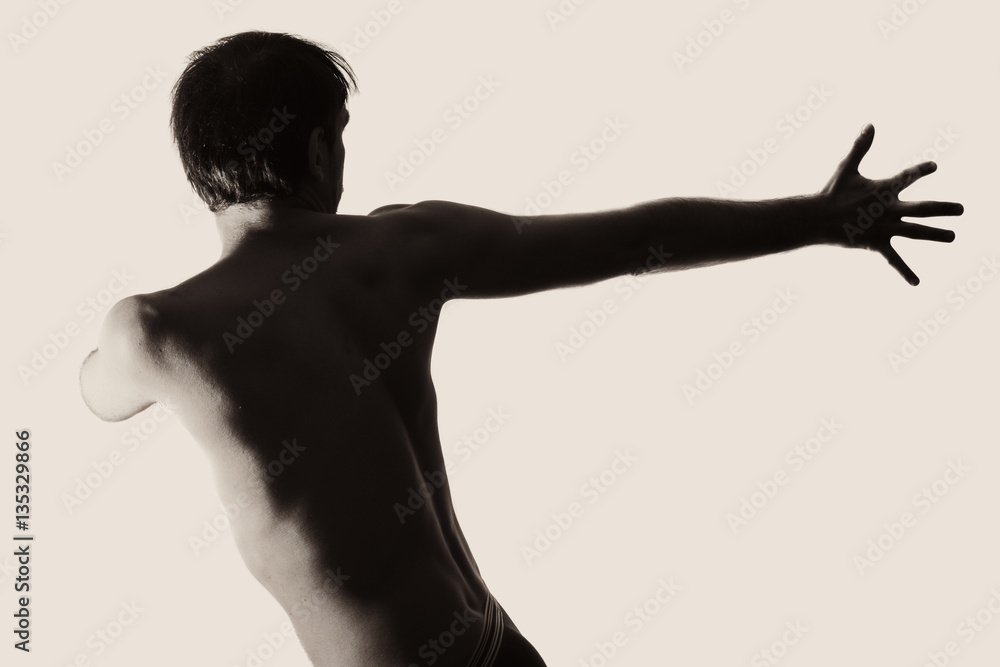 Obraz premium Young naked man dancing