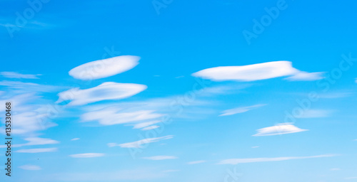 sky and clouds in the form of plates UFO