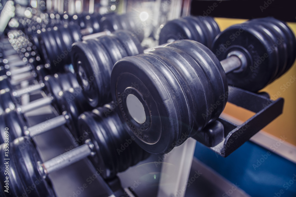 many fitness dumbbells in the gym
