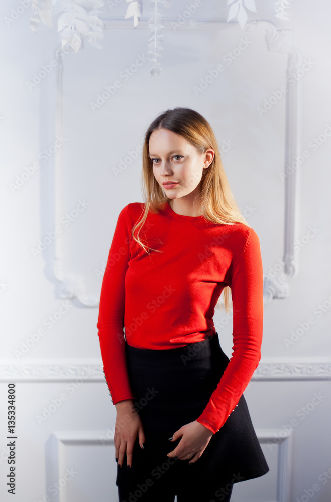 Young woman in red blouse next to brick wall Stylish fashion mod Young woman in red blouse next to brick wall Stylish fashion mod