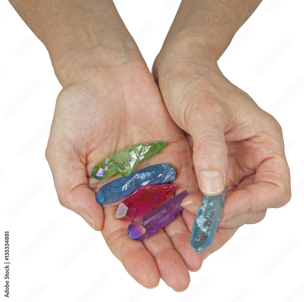 Crystal Therapist Holding Aura Terminated Quartz Wands - female crystal  therapist holding and offering a selection of brightly colored aura quartz  wands isolated on a white background Stock Photo | Adobe Stock