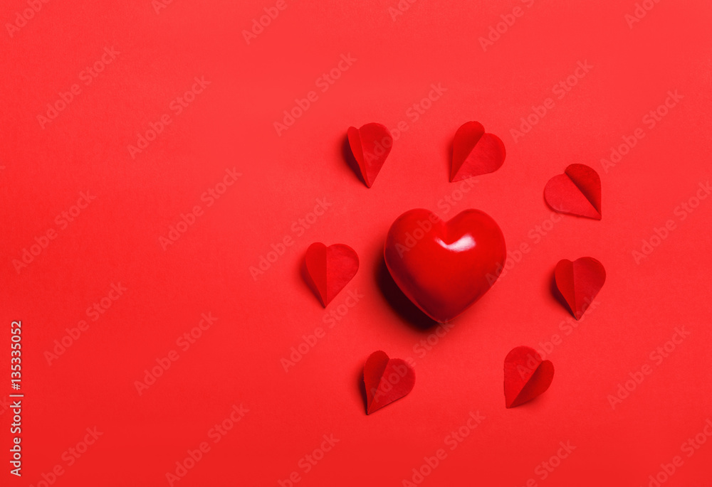 The red Heart shapes on abstract light glitter background in lov