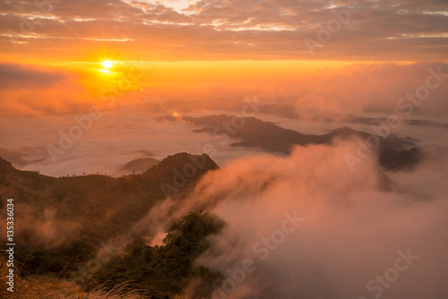 The beautiful sunrise over landscape of the sea mist cover the highland mountains named Phu Chi Dao located in Chiang Rai province in northern region of Thailand. © boyloso