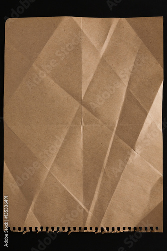 old paper sheet isolated on black background